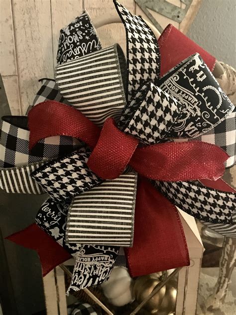 Seated in a burlap bag base and tied with a big red bow. Custom Christmas bow with ribbons from 5th Steet Studio on ...