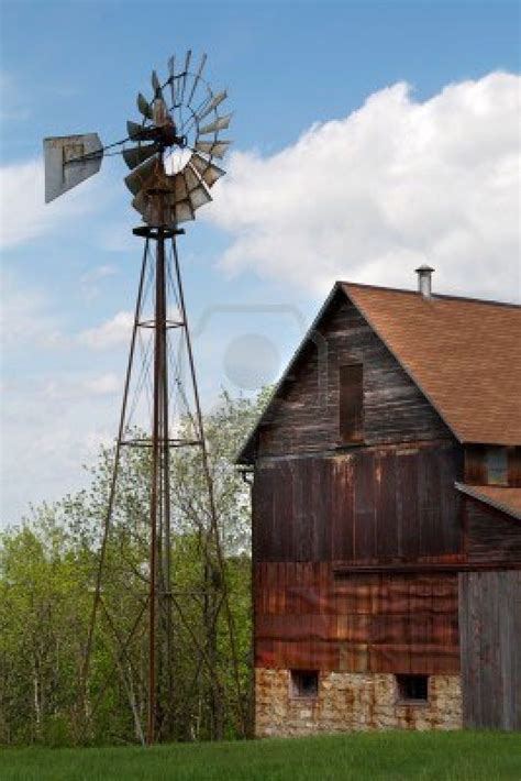 An Old Abandoned Farm Barn And Windmill Stock Photo Farm Windmill