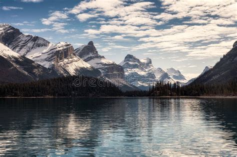 Canadian Rockies With Blue Sky Reflection On Maligne Lake In Jasper