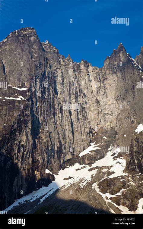 Early Morning Sunlight On The 3000 Feet Vertical Troll Wall In