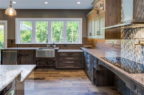 The best way to achieve a distressed look in a flat kitchen is to use sandpaper. This rustic style kitchen design was created as part of a ...