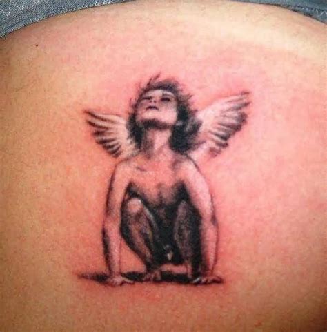 Latest Red And Black Color Ink Baby Angel Tattoo On Girl