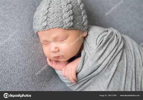 Newborn Baby Sleeping Curled Up In Grey Blanket Stock Photo By ©tan4ikk