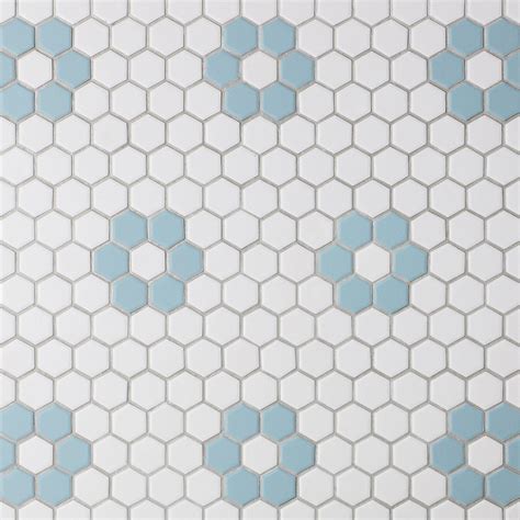A White And Blue Tiled Wall With Hexagonal Tiles