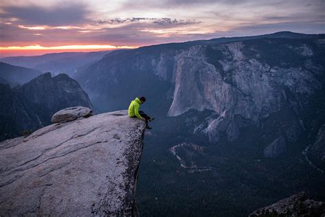 Man Sitting On The Edge Of A Big Cliff Photograph By Paolo Sartori Pixels