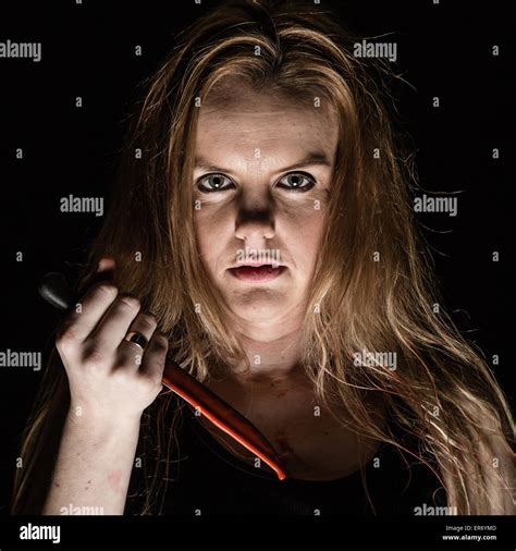 A Young Woman Holding A Bloody Knife Stock Photo 83132013 Alamy