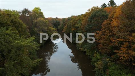 Aerial Fly Over Drone Footage Of A Calm River In The Middle Of Thick