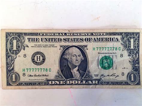 The serial number on this dollar bill is almost all 7's : mildlyinteresting