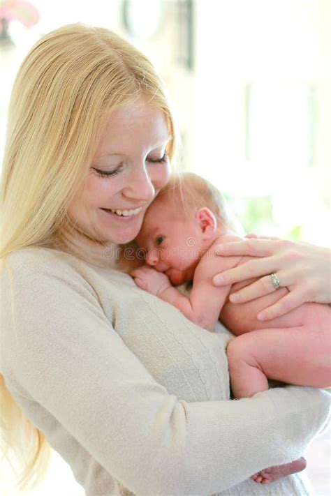 Happy Young Mother Holding Newborn Baby Stock Photo Image Of Snuggle