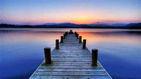 Download Peaceful Wooden Dock By The Lake Wallpaper