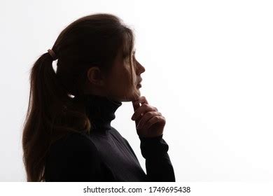Silhouette Portrait Pensive Girl Hand Under Stock Photo 1749695438