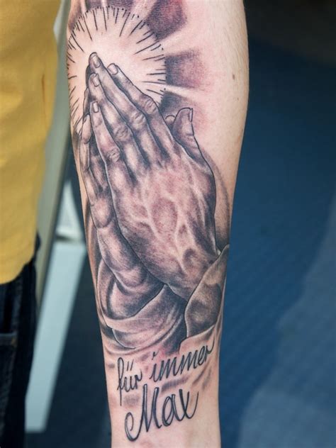 This tattoo shows a pair of praying hands holding a rosary. 65+ Images OF Praying Hands Tattoos - Way to God