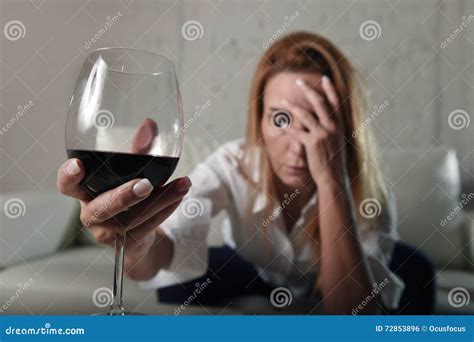 Sad Depressed Alcoholic Drunk Woman Drinking At Home In Housewife