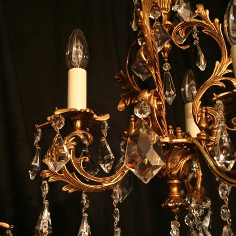 An Italian Pair Of Gilded Cast Brass And Crystal Antique Chandeliers