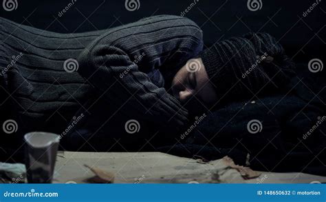 Homeless Person Sleeping On Street Shelter For Poor People City