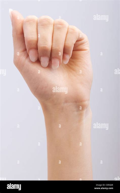 Female Hand Fingers Folded Into Palm Stock Photo Alamy