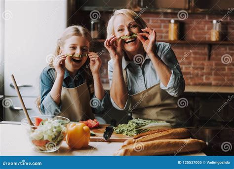 Grandma And Granddaughter Having Fun In Kitchen Stock Image Image Of