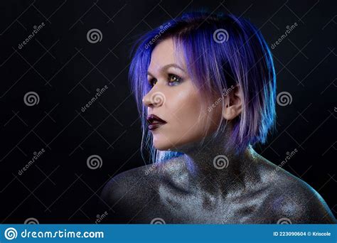 Portrait Of A Stylish And Daring Young Woman With Purple Hair Stock