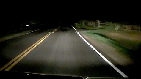 Chilling footage shows mysterious shadowy figure run past car in the