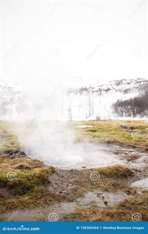 Steam Rising From Geothermal Pools In Icelandic Countryside Stock Photo