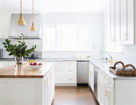 White cabinetry is a classic choice for a kitchen. White Kitchen Cabinets with Brass Hardware - Contemporary ...