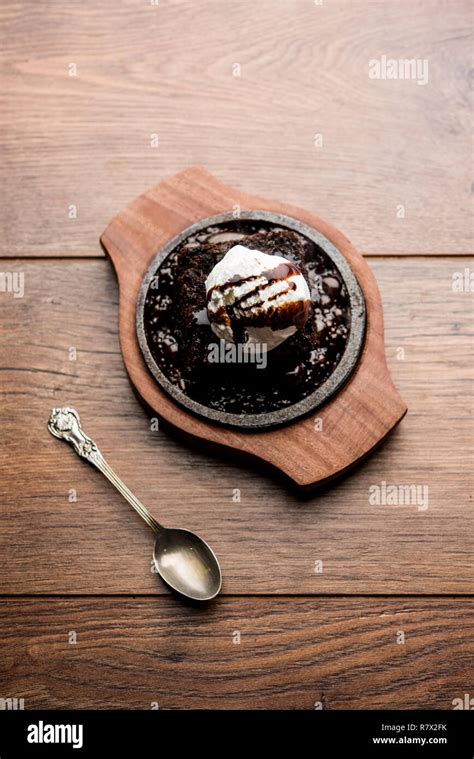 Sizzling Chocolate Brownie Is A Sweet Dish Made Using Scoop Of Ice