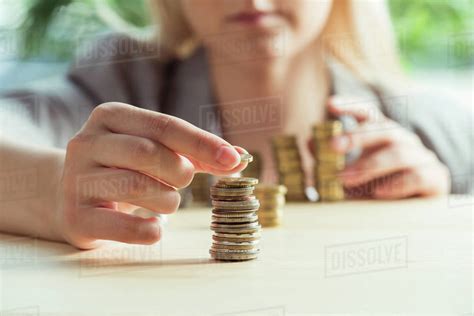 Cropped View Of Woman Stacking Coins On Table Investment Concept