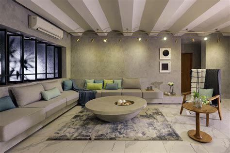 Vadodara Rustic Finishes And A Grey Palette Claim Ownership In This Home