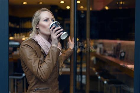 Young Woman In Brown Jacket Sipping Coffee Stock Photo Image Of