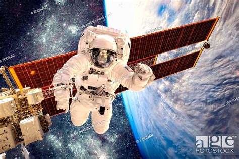 International Space Station And Astronaut Stock Photo Picture And