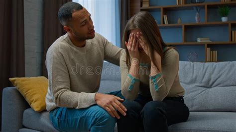 Guilty African American Man Apologizing To Crying Woman Caring Husband