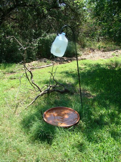 How to make a water dripper for birds. Bird Bath Dripper Birds love gently moving water Punching Holes: • Carefully punch 2 pinholes in ...