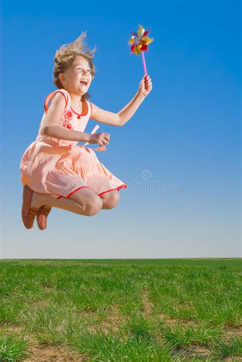 Playful Girl Jumping Stock Image Image Of Meadow Spring 5142117