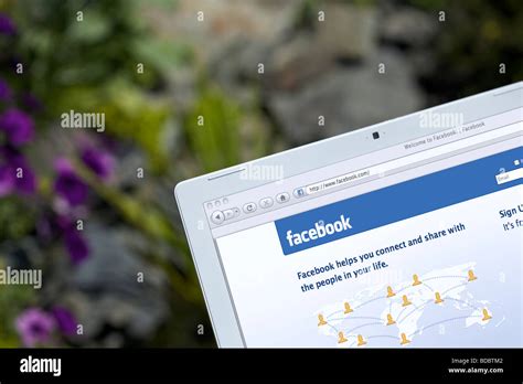 Laptop Showing Social Networking Facebook Splash Screen Page Stock