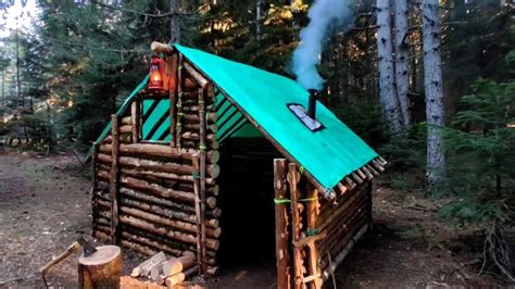 Building Complete And Warm Survival Shelter Log Cabin Building In The