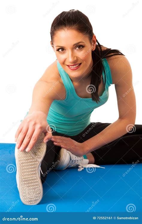 Woman Stretching Legs On Blue Mat Isolated Over White Background Stock