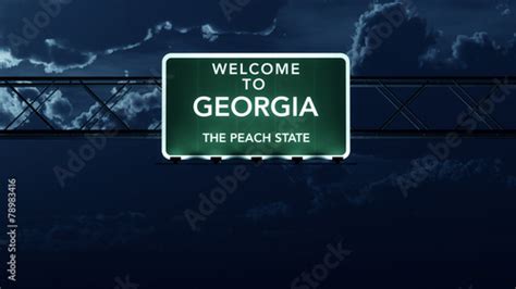 Georgia Usa State Welcome To Highway Road Sign At Night Stock Photo