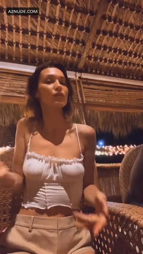 bella hadid shows her pokies during dancing braless in a white top in this short tiktok video