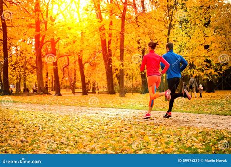 Couple Jogging In Autumn Nature Stock Image Image Of Action Path