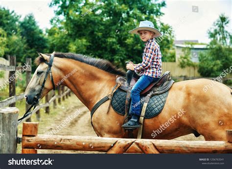 Boy Riding Horse Childrens Ranch Holidays Stock Photo 1256763541