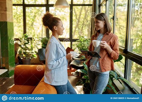 Happy Cheerful Coworkers Chatting At Workplace Stock Image Image Of