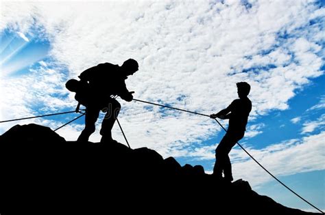 Men Climbers Help Each Other In The Mountains Stock Photo Image Of