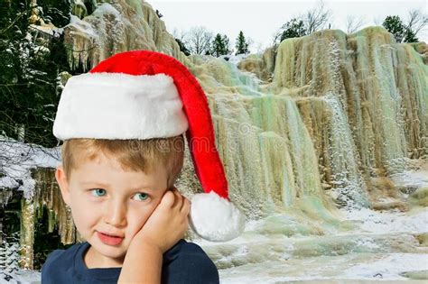 Adorable Boy In Red Santa Claus Hat Is Smiling Stock Photo Image Of