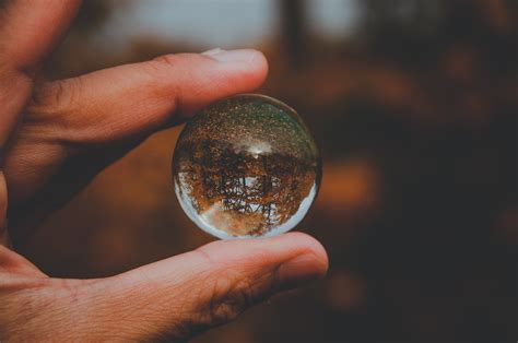 A Person Holding A Glass Ball Pixeor Large Collection Of