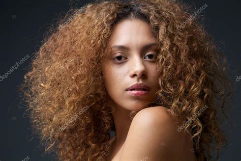 Beauty Portrait Of A Beautiful Female Fashion Model With Curly Hair