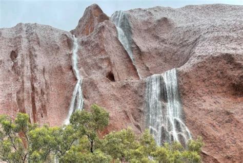 Amazing Waterfalls Cascade Down Sacred Uluru In Australia Videos And