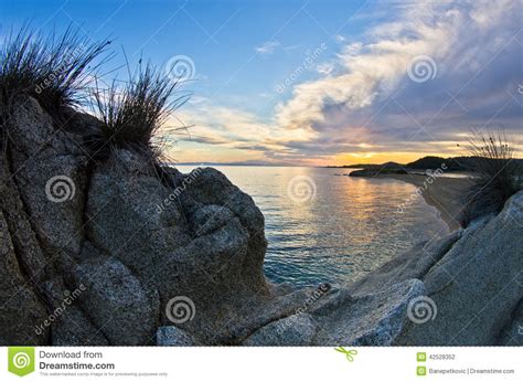 Rocks Sand Sea And A Beach With A Small Cave At Sunset Sithonia