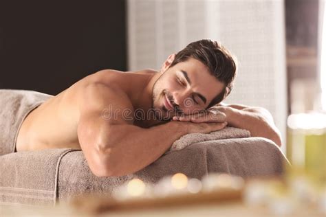 Handsome Young Man Relaxing On Massage Table Stock Image Image Of
