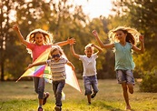 Group of happy children running in public park - Webster United Methodist