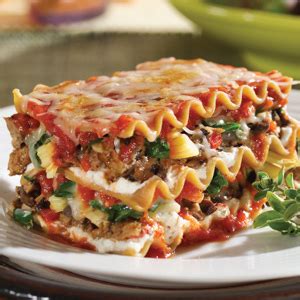 What happens when italian sausage, mozzarella, spinach, and spicy peppers are wrapped in the loving embrace of freshly baked dough you made this homemade dough recipe can be kneaded with a stand mixer or just your hands. Mushroom, Spinach & Artichoke Lasagna Recipe | MyRecipes.com